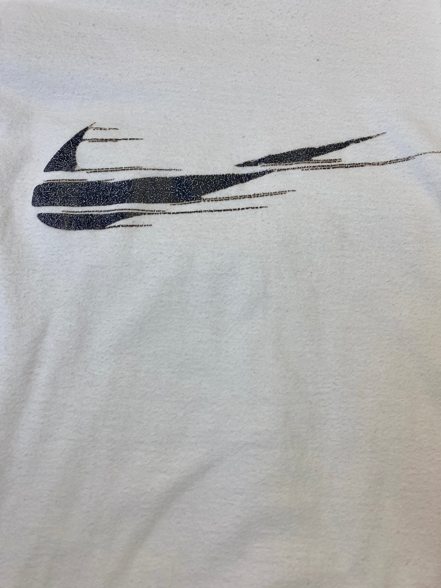 T-shirt contrefait Nike avec logo effacé